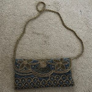 Elegant Gold and Black Beaded Clutch